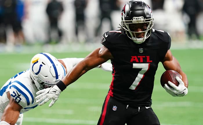 Atlanta Falcons running back Bijan Robinson (7) carries the ball against Indianapolis Colts safety Nick Cross (20) during the first half at Mercedes-Benz Stadium.